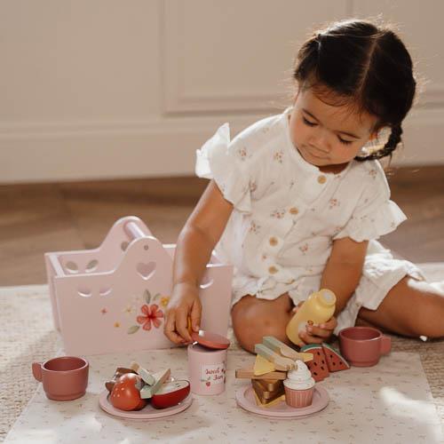 Child enjoying the Little Dutch Wooden Picnic Play Set